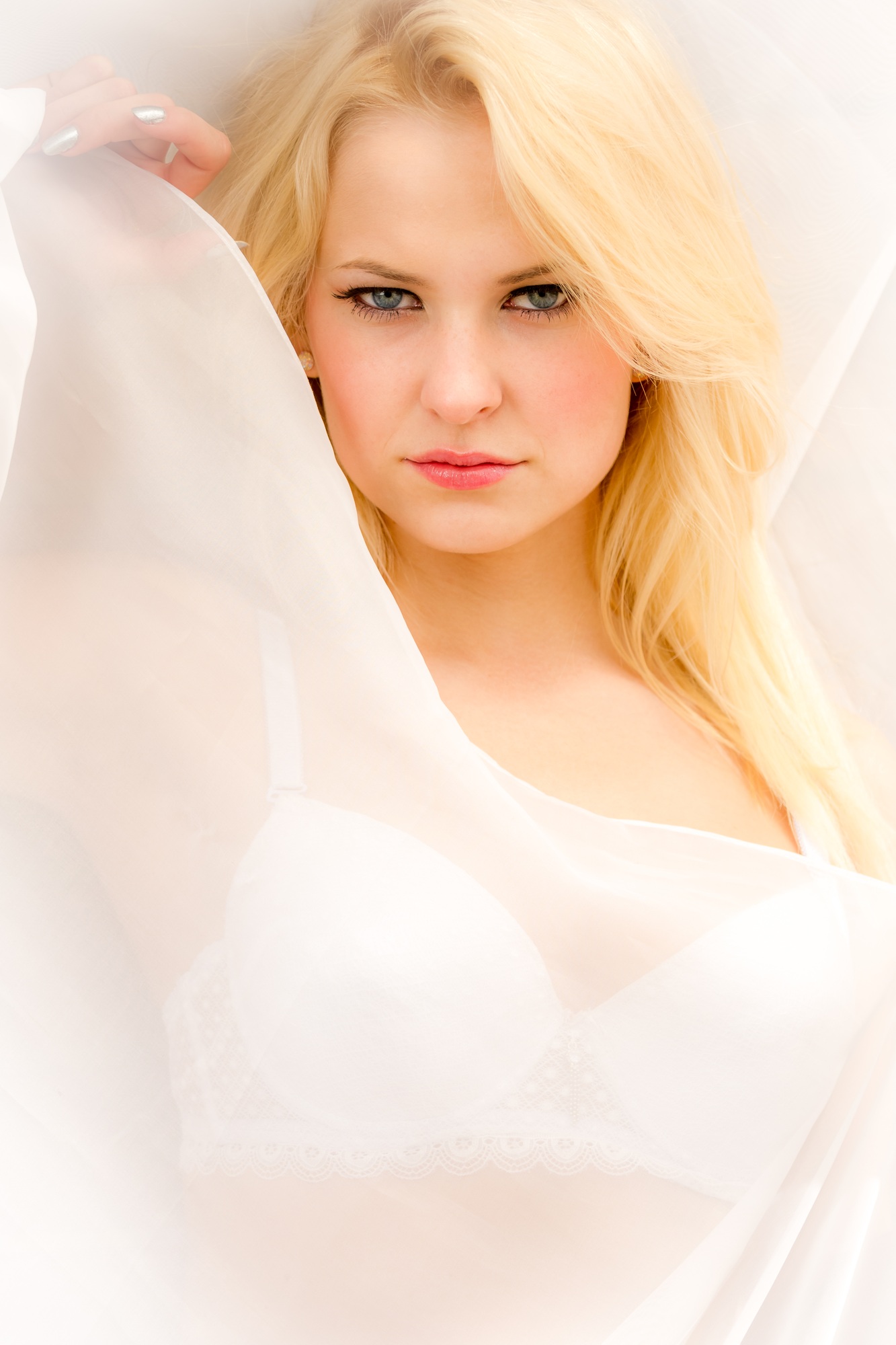 Face of young beautiful woman in bed